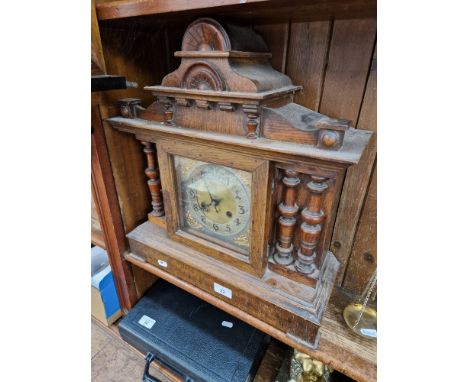 A large oak mantle clock 