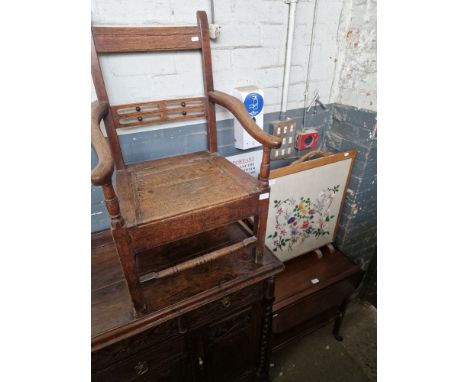 An oak commode chair together with a tapestry firescreen and and a mahogany trolley.