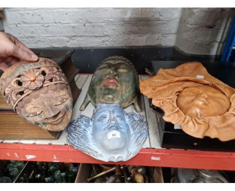 Four assorted masks to include ceramic &amp; wood etc. 