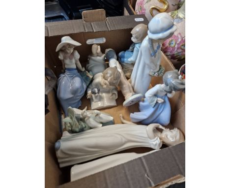 A small box containing 8 Nao figures and one other 