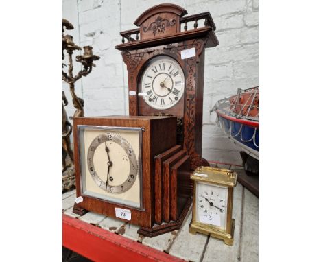 An Art Deco oak cased mantle clock, an American shelf clock and a brass carriage clock.