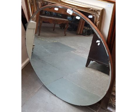 A 1930s circular bevel edged wall mirror, diameter 84cm.