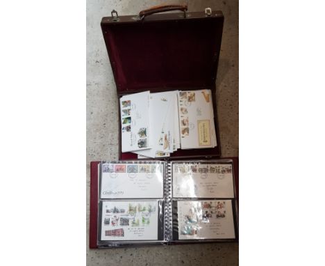 An album and a case of First Day Covers. 