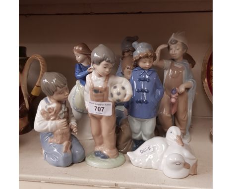 Ten Nao figurines. 