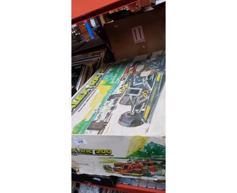 A Scalextric 200 electric model racing set, complete with cars.