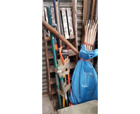 A bundle garden tools together with a bundle of drain rods, a set of wooden step ladders and a heavy duty fence post spade