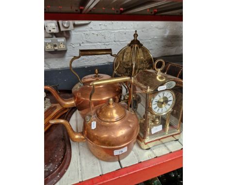 Two copper kettles, a mantle clock &amp; a table lamp.