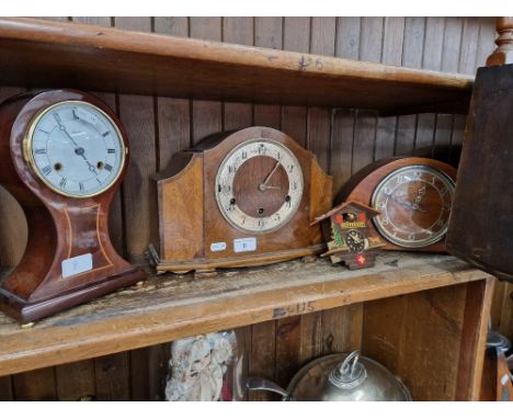 Three assorted wooden mantle clocks &amp; a vintage Swiss miniature chalet novelty clock. 