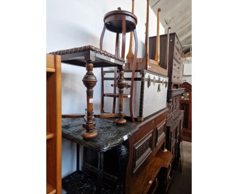 Four occasional tables together with a oak and leather stool and an aluminium travel trunk with brass fittings. 