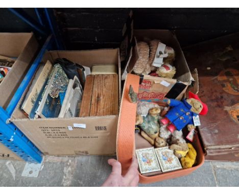 A vanity case, a suitcase, and a box, each containing teddy bears and soft toys etc