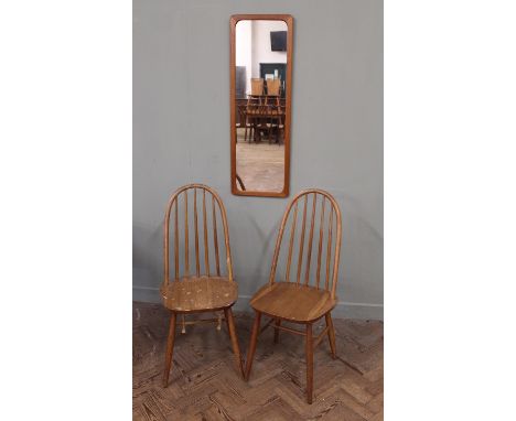 Two Ercol stick back chairs and a wall mirror