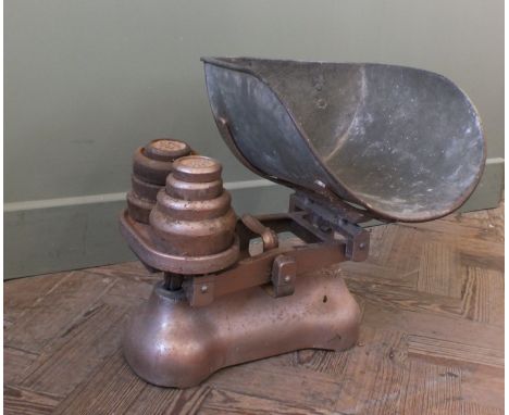 A vintage set of fruit scales and weights