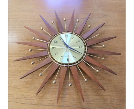 A vintage Seth Thomas starburst wall clock