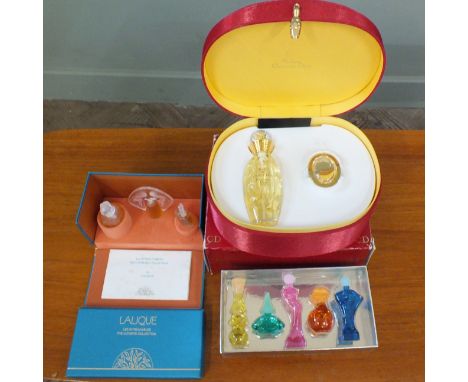 A boxed set of miniature Lalique perfume "Les Introuvables", a Salvador Dali collector edition perfume miniatures and a bottl