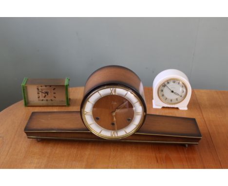 A collection of vintage and retro style clocks including Smiths and Essa