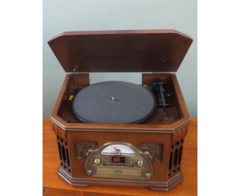 A Steeple tone record play/cassette player in the form of an vintage radio. This item is sold as a Collectors item only and h