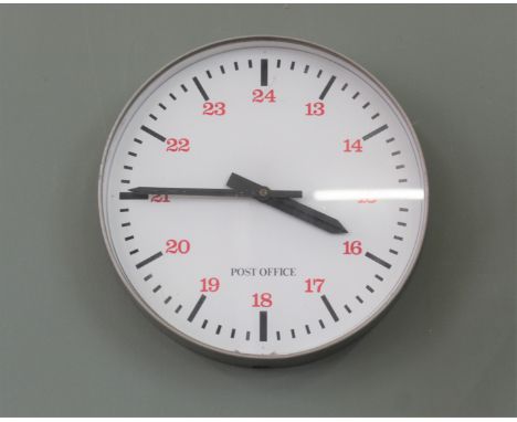 A vintage wall clock marked Post Office