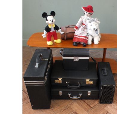 A vintage Mickey Mouse, other toys, two lawn bowls in leather carry case and a selection of cases