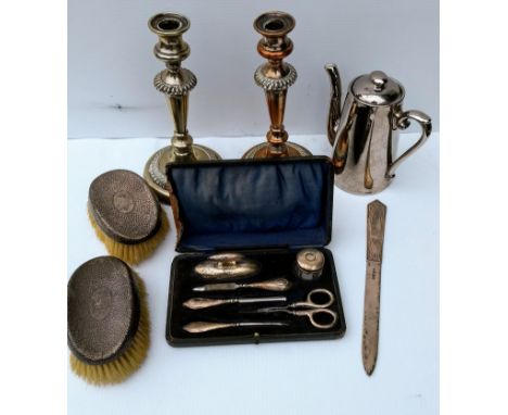 An Edwardian cased silver travel nail set by W J Myatt & Co, Birmingham, 1913, (case in poor condition) a near matching pair 