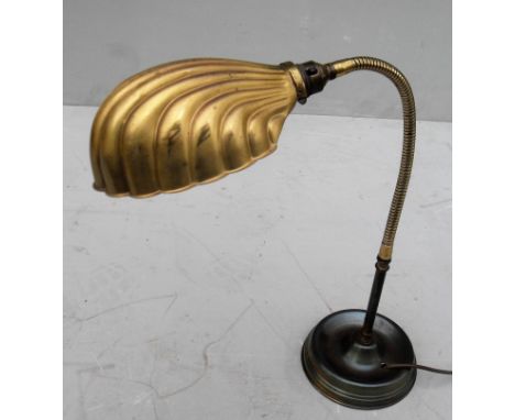 A vintage brass adjustable desk lamp with scallop-shaped shade, extending to 75 cm and a 19th century mahogany desk book trou