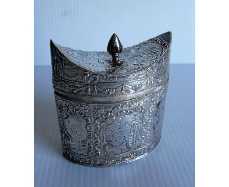 A late-19th century Dutch silver tea caddy, 1890, oval form, embossed with figural vignettes within foliate scroll borders an