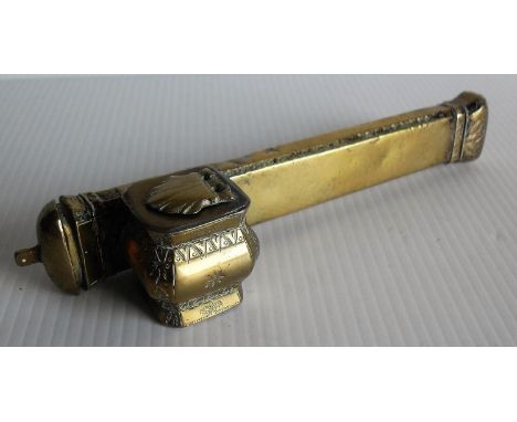 An early 20th century Islamic brass travel inkwell or Qalamdan with quill holder and inkwell compartment, 20 cm W 