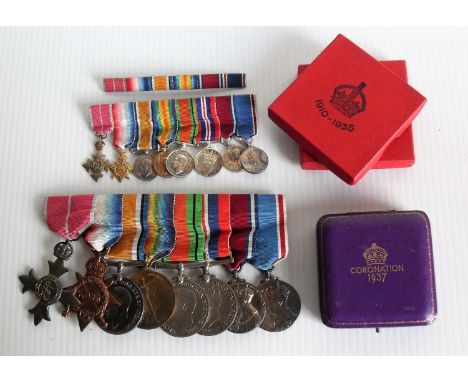 A mounted group of eight WWI, WWII medals and equivalent dress medals awarded to PAYR. LT. A. C. M. EDMONDS. R.N. comprising: