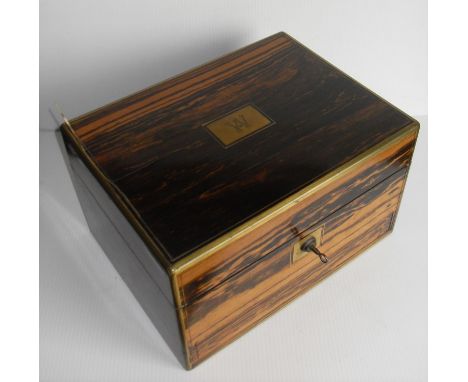 A Victorian coromandel ladies necessaire or vanity case, the interior opening to reveal silver plated-topped bottles and jars