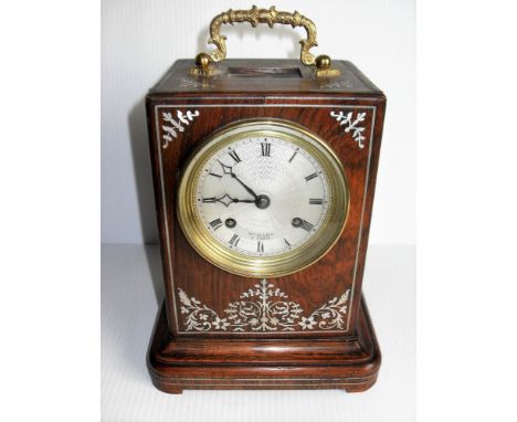 A 19th century French mantel clock with engine turned silvered Roman dial, twin train bell striking movement with silk suspen