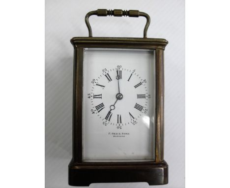 An early 20th century brass carriage clock by P. Orr & Sons, Madras with white enamel dial and Roman numerals, 10574, 11 cm H