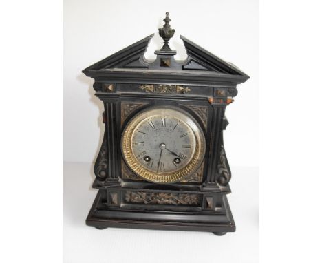 A Victorian lacquered mantle clock retailed by Camerer Kuss & Co, London and Lenzkirch mechanism, Roman numerals, brass bezel