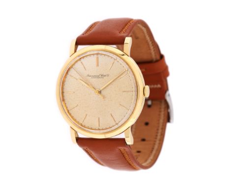 IWC wristwatch, gold, men, automatic movement. Ivory-coloured dial, with gold indices. Aftermarket brown leather strap and st