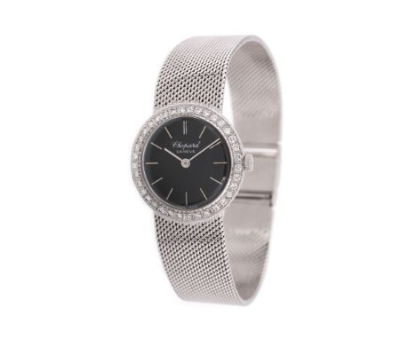 Chopard wristwatch, white gold, women, manual winding movement. Black dial and bezel adorned with diamonds. Original bracelet