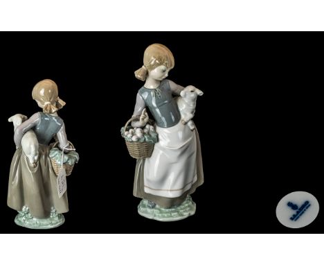 1 Lladro Figure ' Girl with Basket and Lamb ' Stamped to Base. Approx 10 Inches High. Condition - Small Chip to Lamb Ear, Oth