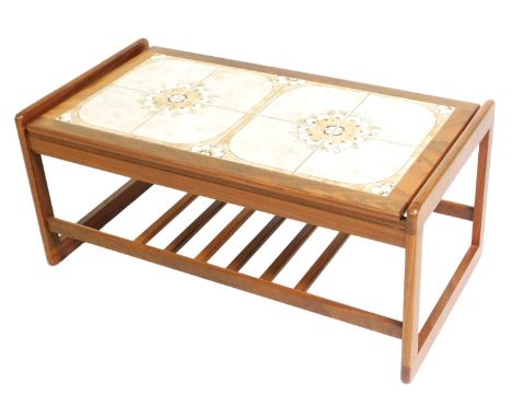 A mid century G-Plan teak coffee table, of rectangular form, with a floral eight tile top, raised on rectangular end supports