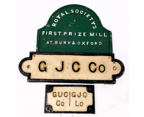 A replica cast iron Royal Society's Sign, First Prize Mill, at Bury &amp; Oxford, 36.5cm wide, and two faux cast iron signs, 