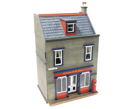 A doll's house shop, "Remains To Be Seen", Angel Row, the three storey building with electric lighting, together with dolls a