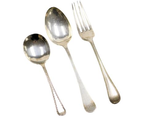 A George V silver jam spoon, Sheffield 1927, dessert spoon, Sheffield 1906, and a Victorian silver fork, Sheffield 1867, 2.73