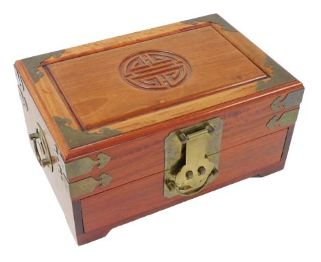 A Chinese hardwood jewellery box, brass bound, with a red silk interior, 30cm wide.