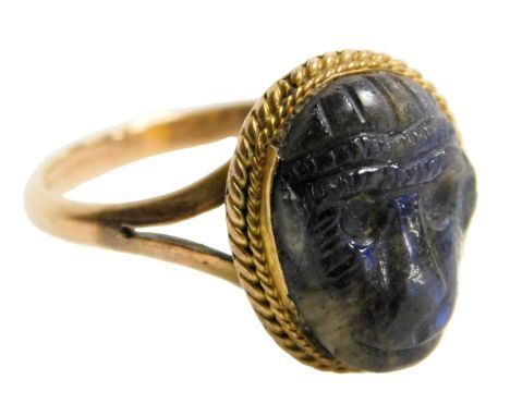 A 19thC black opal ring, carved as the head of a monkey, in a yellow and rose metal setting, stamped 9ct, size L/M, 2.9g.  Th