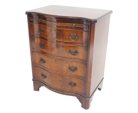 A Georgian style mahogany serpentine bachelor's chest, with a brushing slide over four drawers, raised on bracket feet, 76cm 