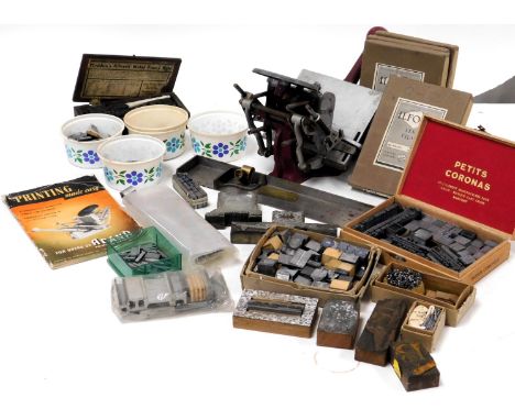 An Adana printing machine, with instruction manual, together with printing blocks, lettering, and tools. (a quantity)