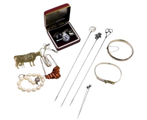 A freshwater pearl bracelet, on a ring and T bar clasp, with a heart shaped pendant, silver bangle, with engraved decoration,