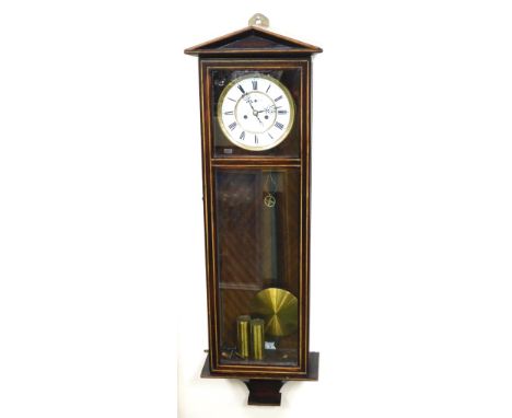 A late 19thC mahogany cased Vienna wall clock, circular brass dial with enamel chapter ring bearing Roman numerals, subsidiar