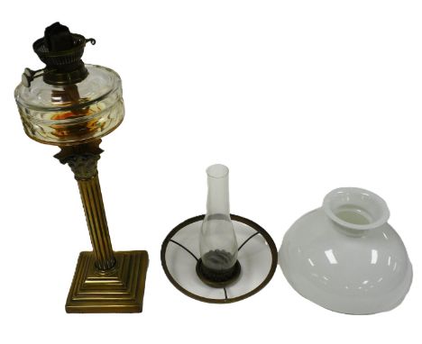 An early 20thC brass Corinthian column oil lamp, with a faceted cut glass reservoir, chimney and milk glass shade, 79cm high.