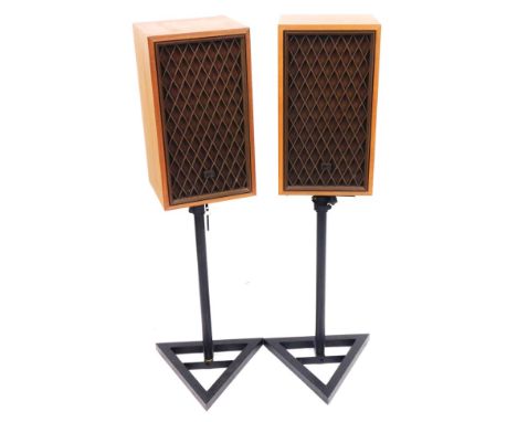 A pair of Realistic Optimus-17 teak cased speakers, O783 and O876, together with two black metal speaker stands.