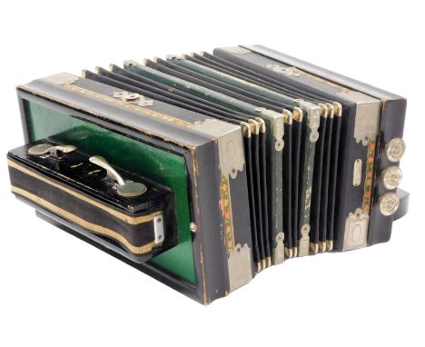 An early 20thC German accordion, ten button function, in an ebonised casing, 34cm wide.