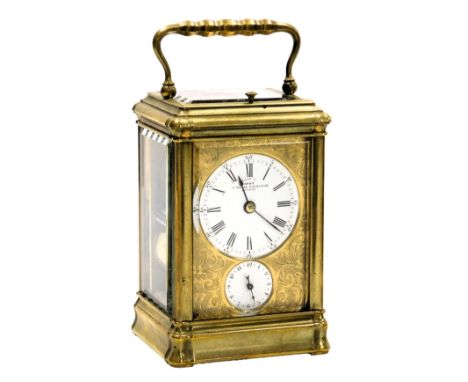 A late 19thC Dent brass repeater carriage clock, Royal Exchange London, circular enamel dial bearing Roman and Arabic numeral