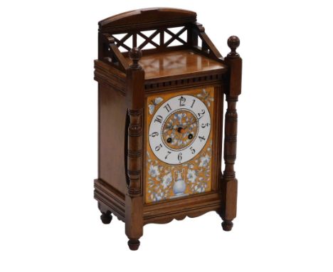 A French late 19thC mahogany cased mantel clock, rectangular ceramic dial painted with an urn of flowers and insects, circula