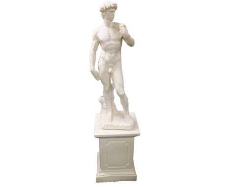 A plaster figure of David, After Michelangelo, raised on a square plinth, 180cm high.